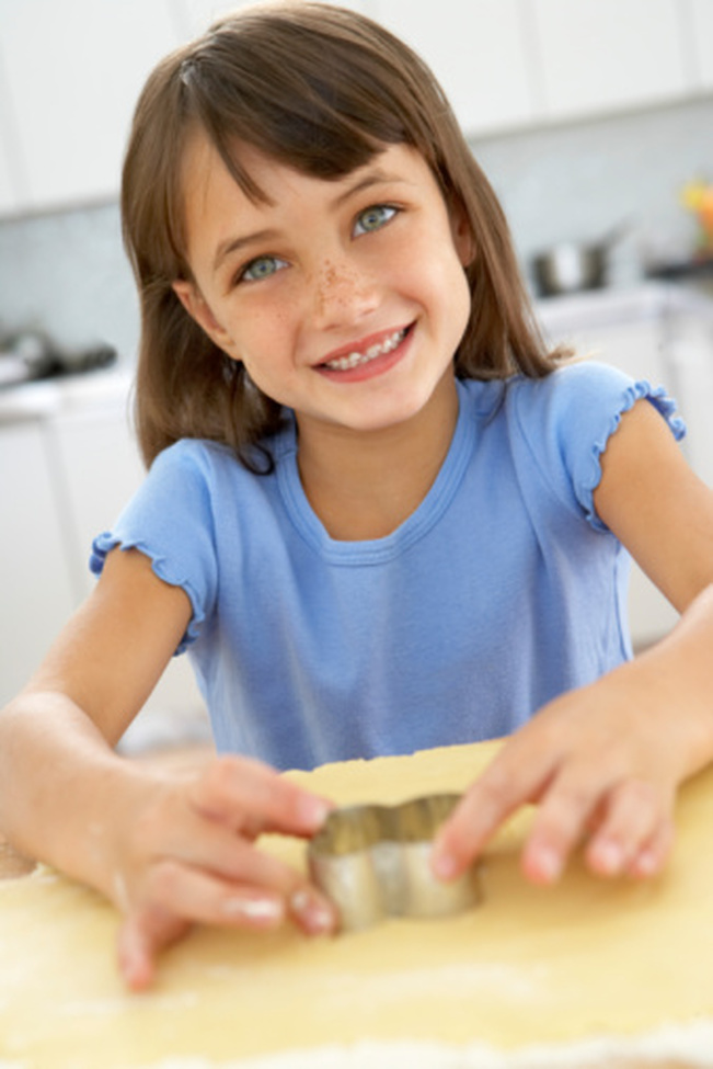 Fun in the kitchen with play dough and cookie cutters - stock photo 