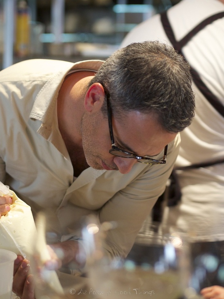 Chef Yotam Ottolenghi puts the finishing touches on a dish at Nomad