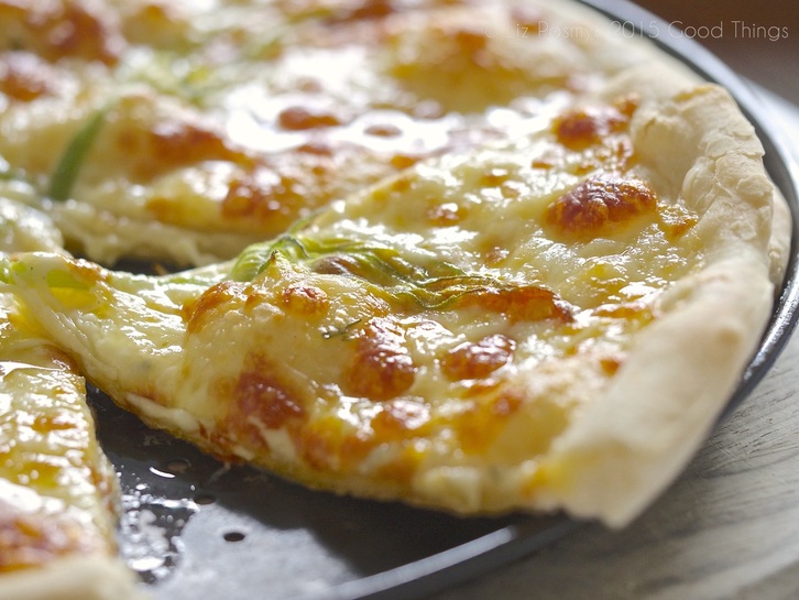 Pizza bianca with zucchini blossoms