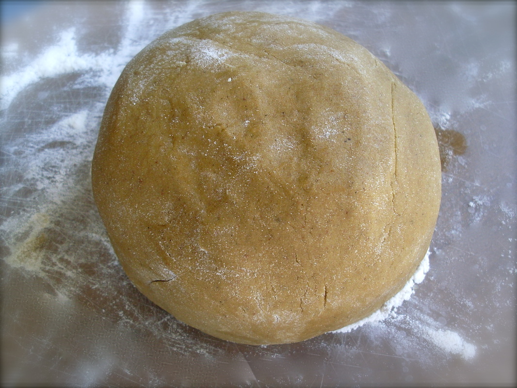 Knead the gingerbread dough until it forms a ball