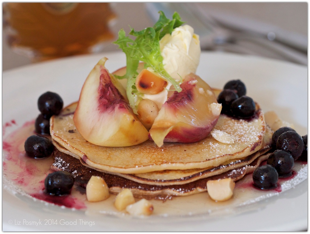 Peach and blueberry hotcakes with macadamias, mascarpone and maple syrup