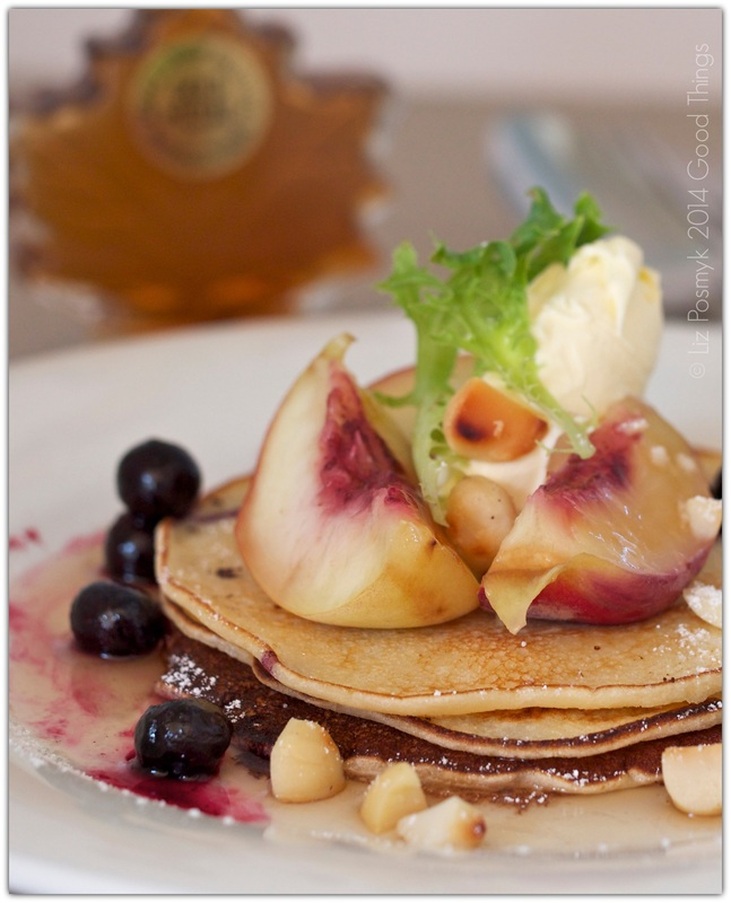 Peach and blueberry hotcakes with macadamias, mascarpone and maple syrup
