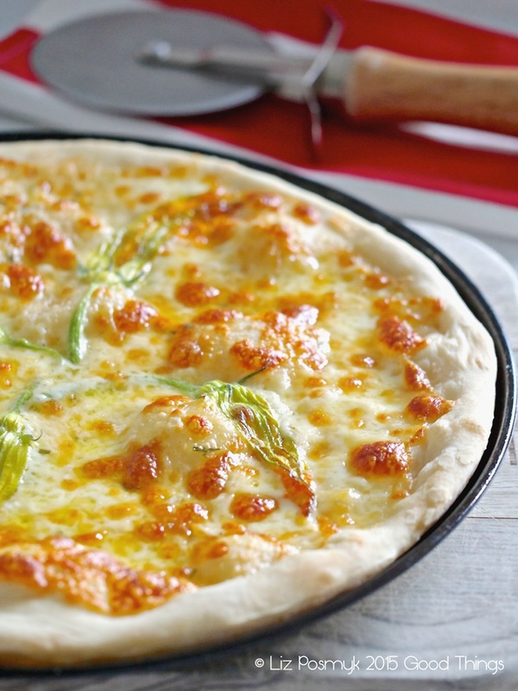 Pizza bianca with zucchini blossoms