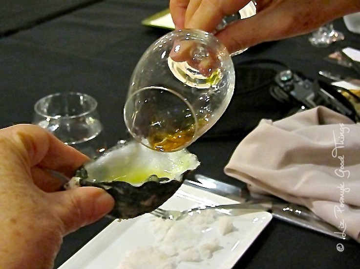 Pouring Laphroaig Quarter Cask onto the oyster at the Dinner with Whisky 
