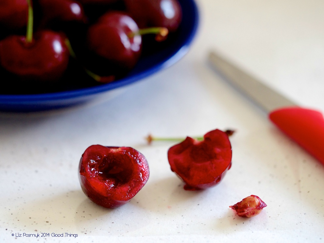 Removing stones from cherries with a paring knife