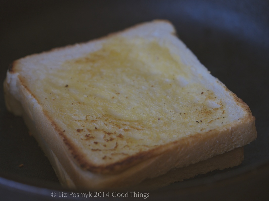 Heat a skillet to smoking and then toast the buttered side of the bread