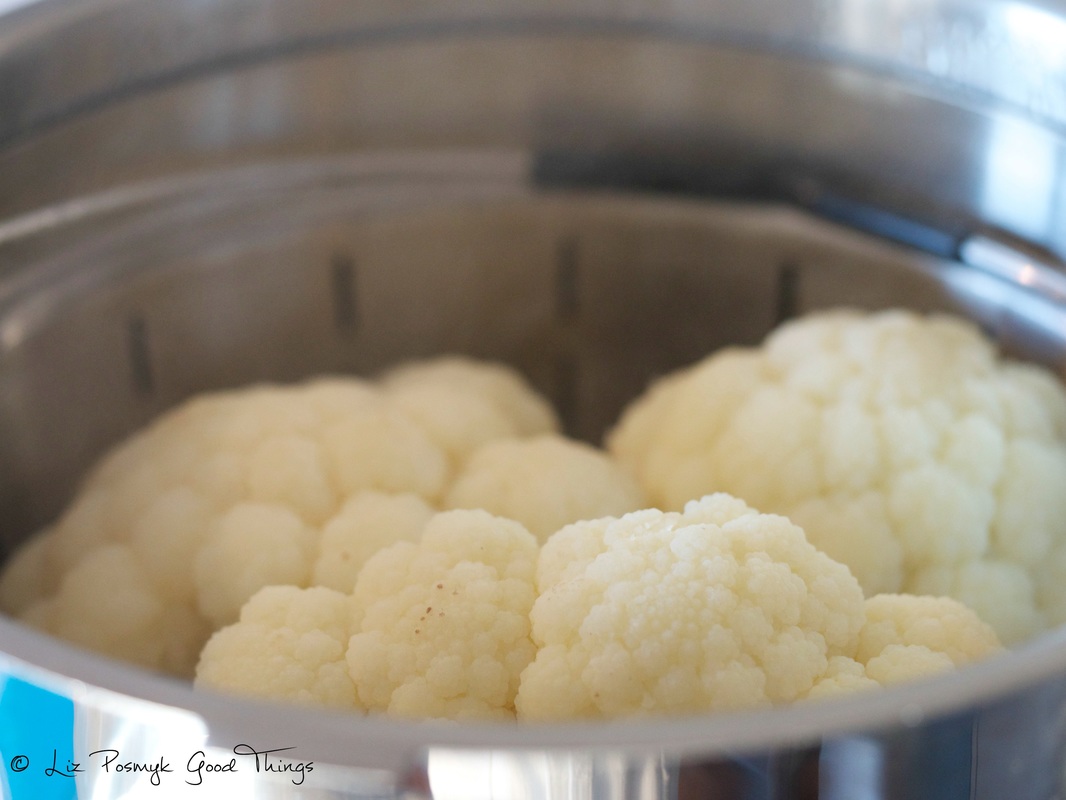 Pop the cauliflower florets into the steamer basket - Liz Posmyk Good Things 
