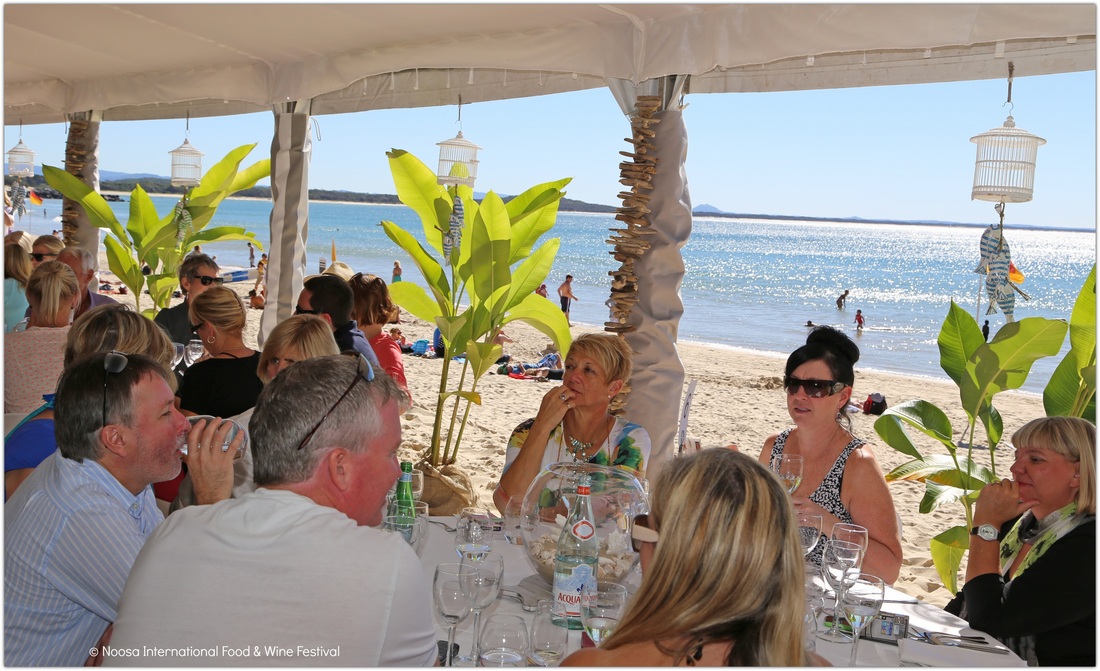 Diners in the marquee on the beach at Noosa