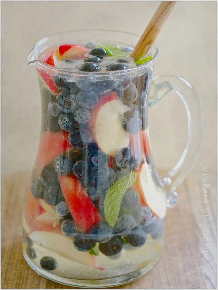 White sangria with blueberry, peach, ginger and mint