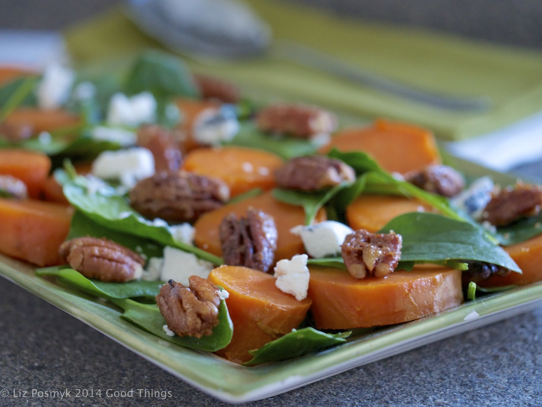 Baked sweet potato with ashed goat cheese, baby spinach and maple pecans