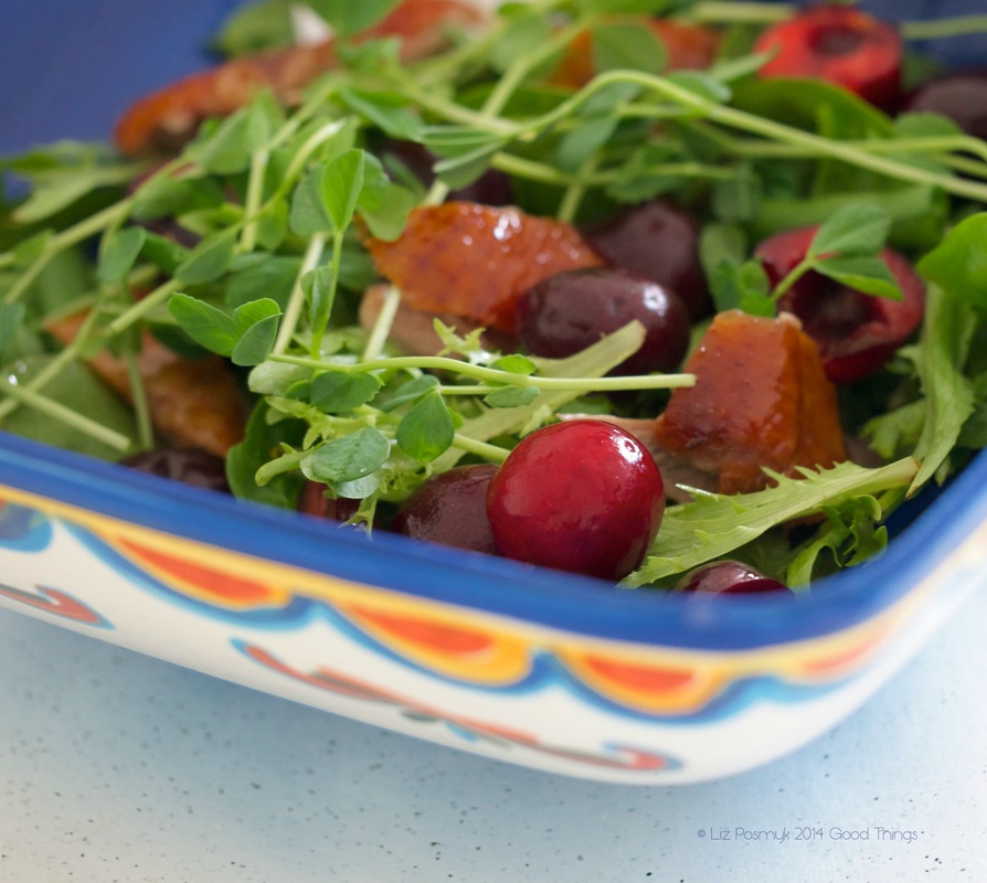 Cherries with salad greens and roasted duck