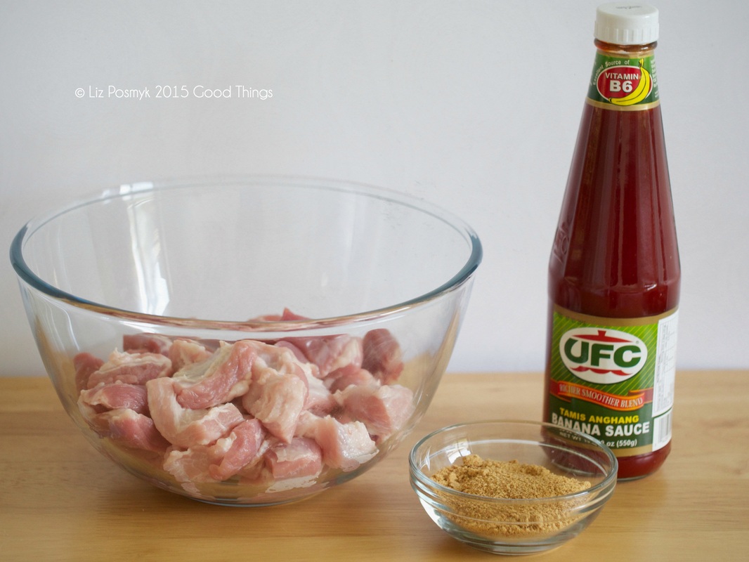Bite sized pieces of pork with banana ketchup or sauce and coconut palm sugar 