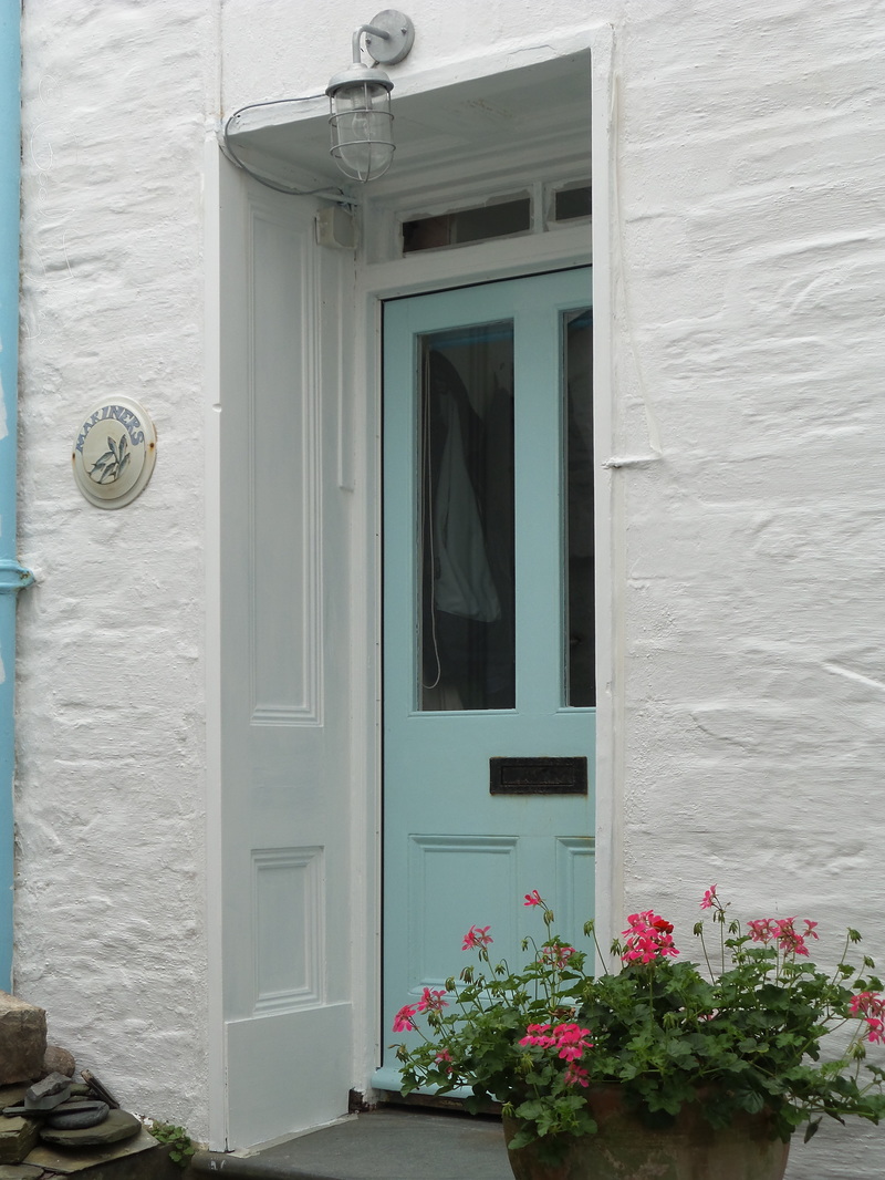 White washed cottage with a duck egg blue front door by Liz Posmyk © Good Things