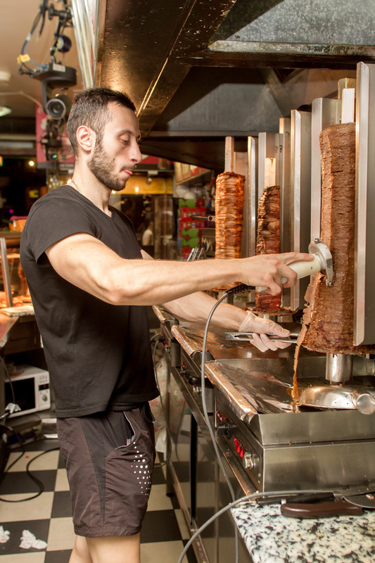 Fardi carves meat - Kebab Kings - image from SBS