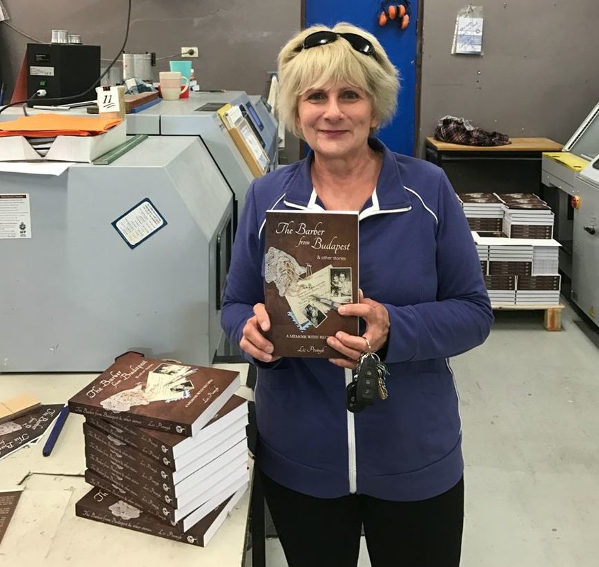 Liz Posmyk takes delivery of her finished book, The Barber from Budapest & other stories