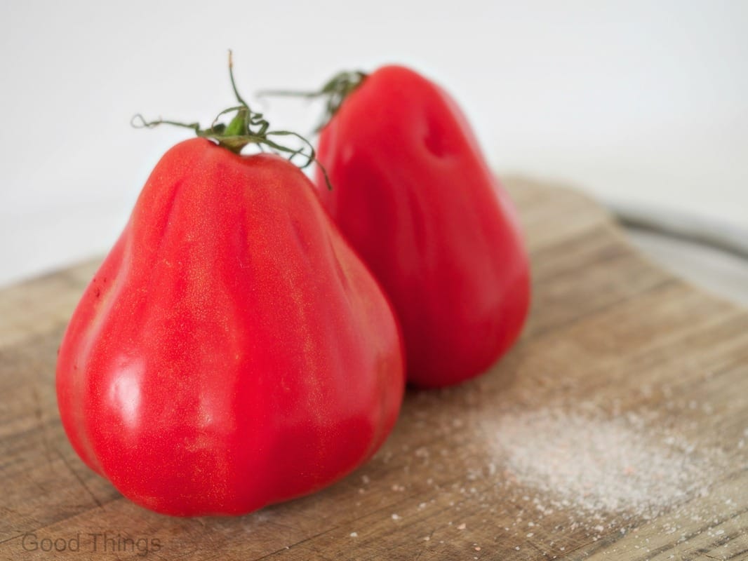 Ox heart tomatoes on board with salt - Liz Posmyk Good Things 