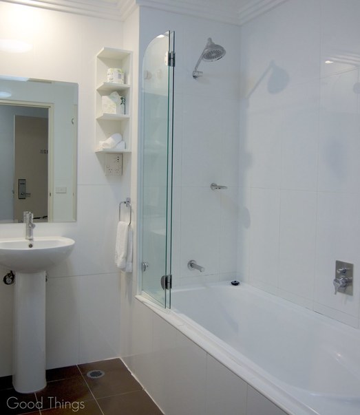Bathroom with shower over bath at the Sebel Harbourside Kiama - Liz Posmyk Good Things